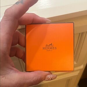 Hermès Orange box with 4 different shades of lipstick shine